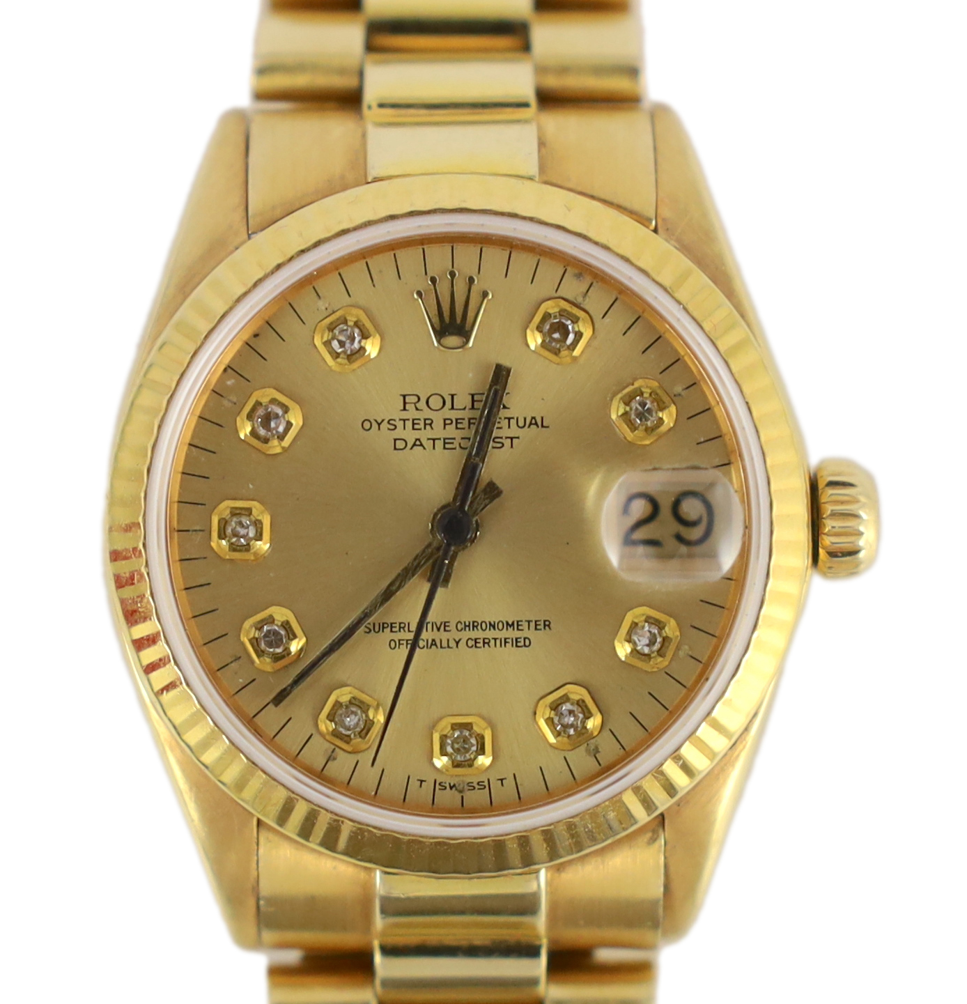 A lady's early 1970's 18ct gold Rolex Oyster Perpetual Datejust wrist watch, with diamond dot numerals, on an 18ct gold Rolex bracelet, with deployment clasp